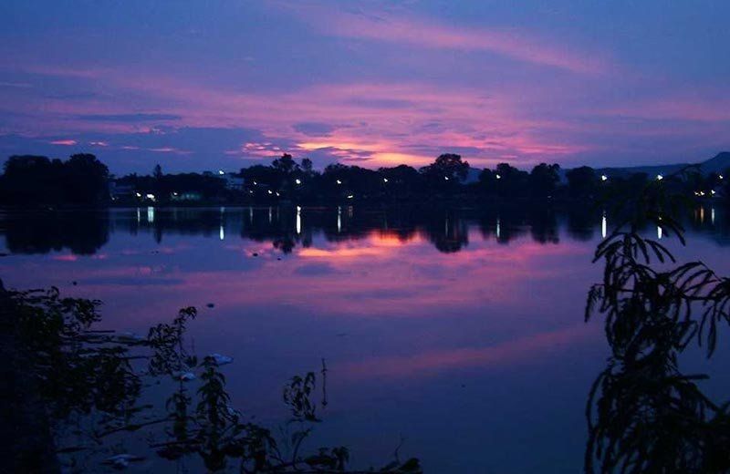 The Periyar in the blue hour, violet sky reflected in still water
