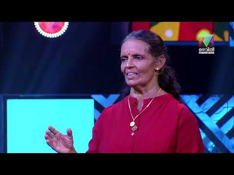 Sudhamma speaking on a television stage, from Mazhavil Manorama